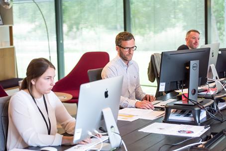 Employees in their office workstations