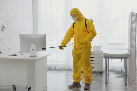A person doing a Sanitation service