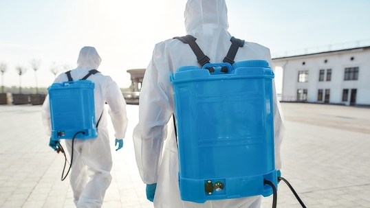 Two personnel doing a Sanitation service