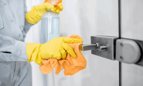 Sanitizing a metal door handle