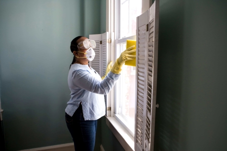 Lady cleaning a window